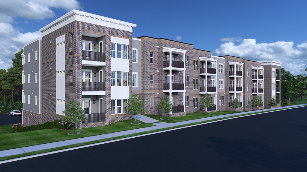 Luxury Apartments in Nashville, TN with In-Unit Washer and Dryer - Crest at Stones Branch - Street View of Property Highlighting Concrete Pathway, Manicured Front Lawn, Private Patios and Balconies, and Wooded Area.