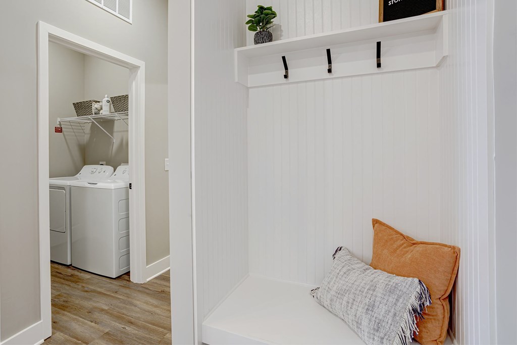 A laundry room with a washer and dryer in it.
