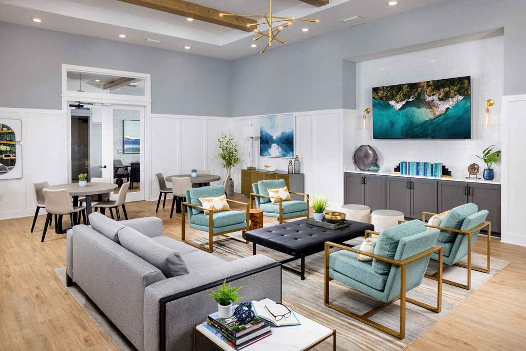 a living room with couches and chairs and a table