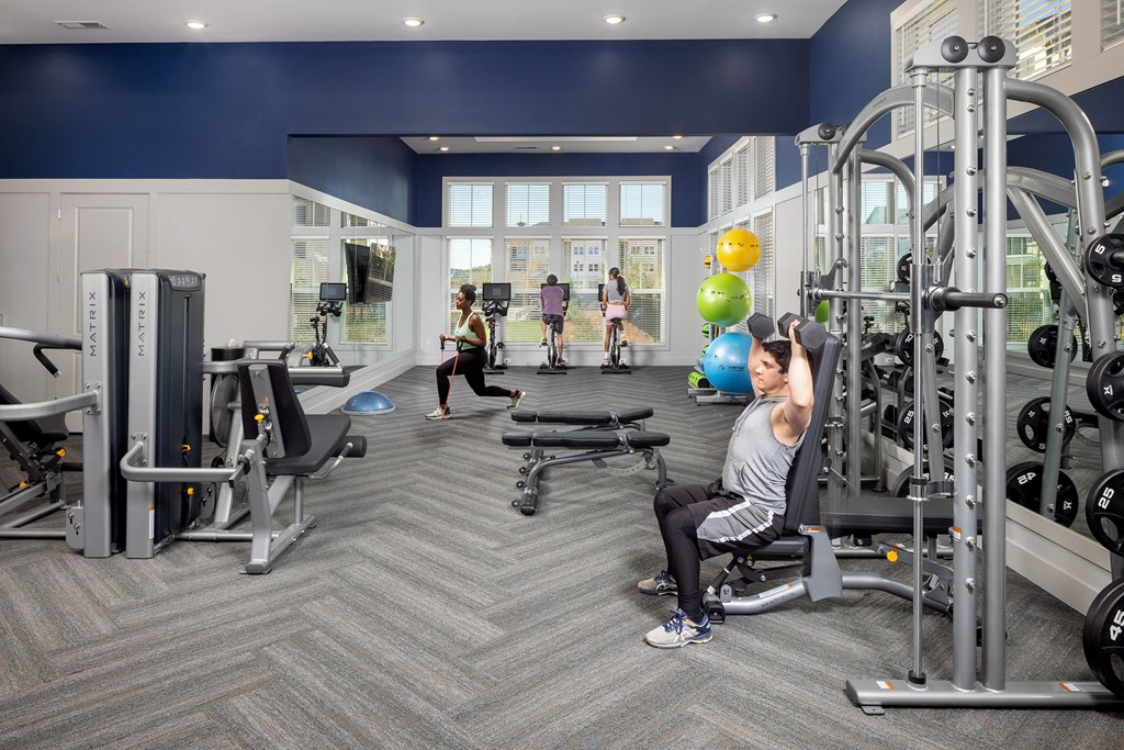 a group of people working out in a gym