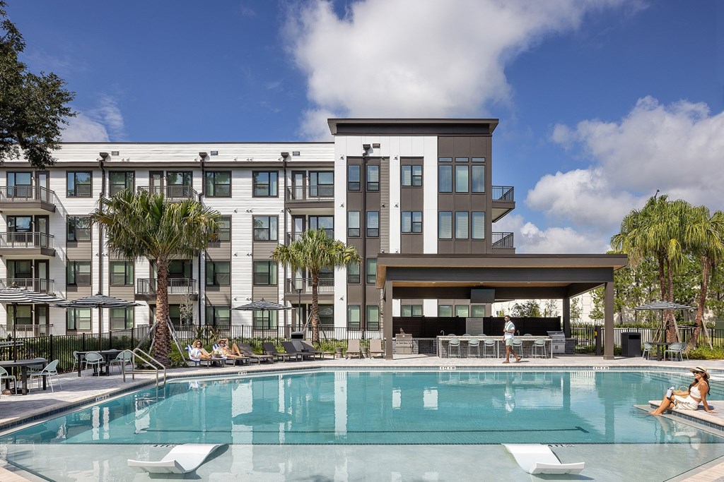 a swimming pool with a building in the background