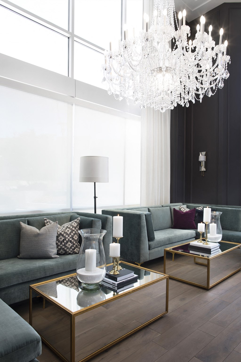 a living room filled with furniture and a large chandelier