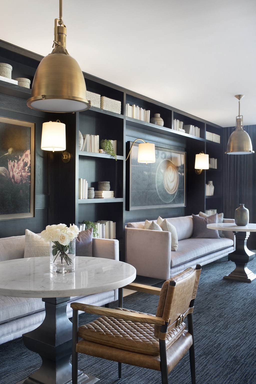 a living room filled with furniture and a large window