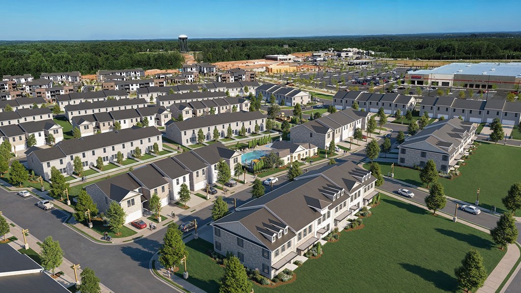 A large residential complex with multiple buildings and a swimming pool.