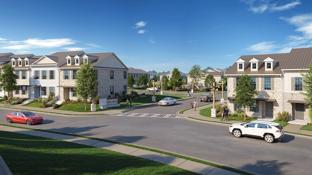 A street view of a residential area with cars and houses.