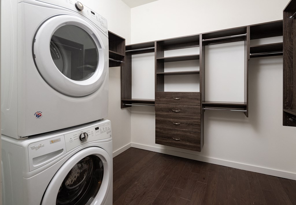 a washer and dryer sit next to each other in a laundry room