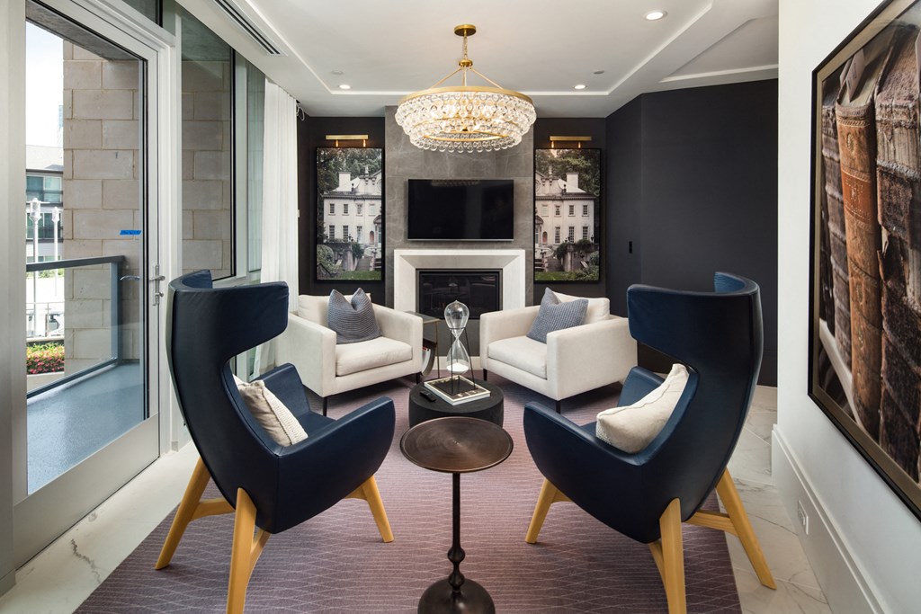 a living room filled with furniture and a large window