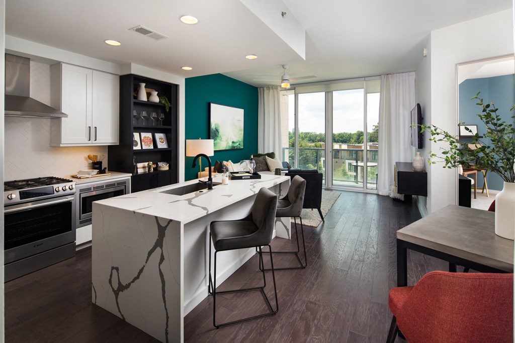 a kitchen and dining area in a 555 waverly unit