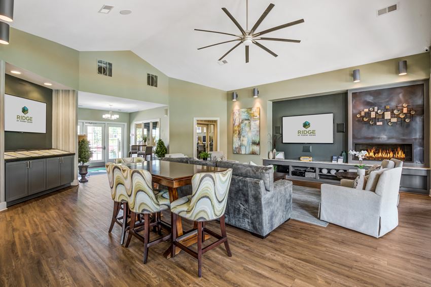 a living room with a dining room table and a fireplace