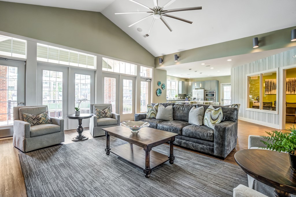 a living room with couches and chairs and a table