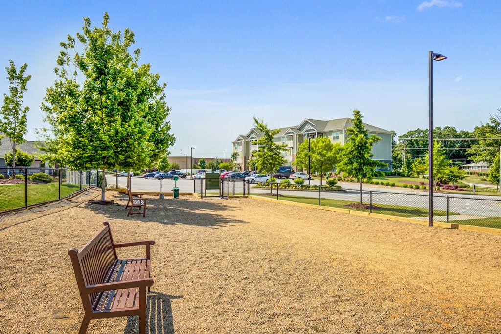 the preserve at ballantyne commons park benches in front of a playground and buildings