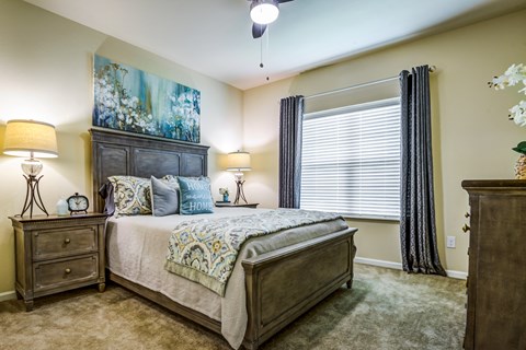 a bedroom with a large bed and a window