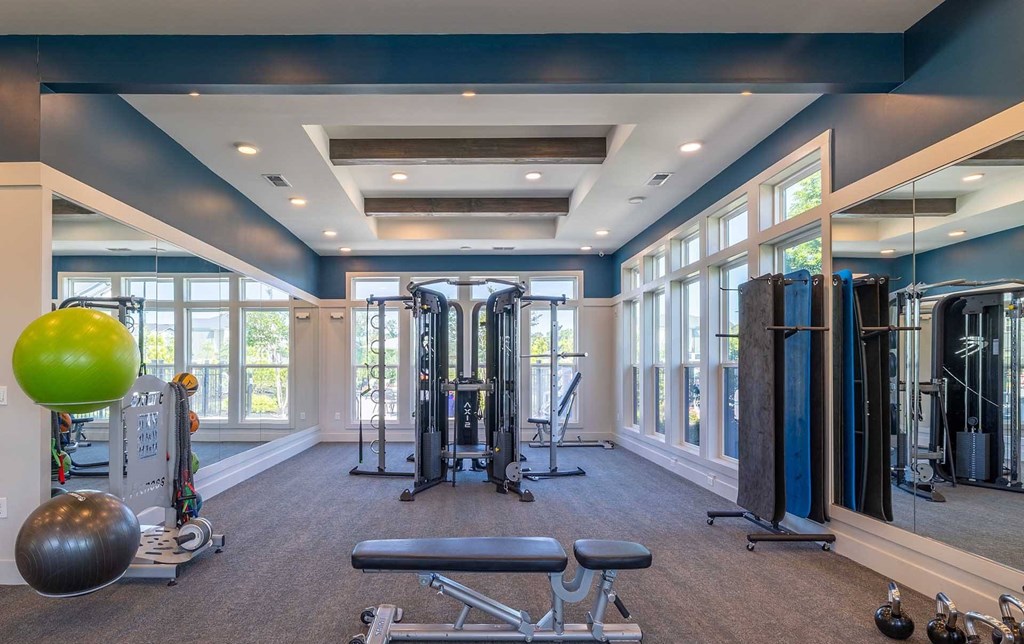 A spacious home gym with a variety of exercise equipment.