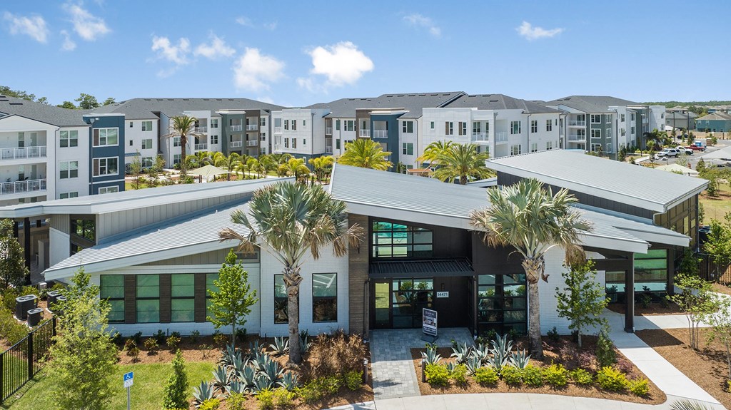 a building with palm trees in front of it