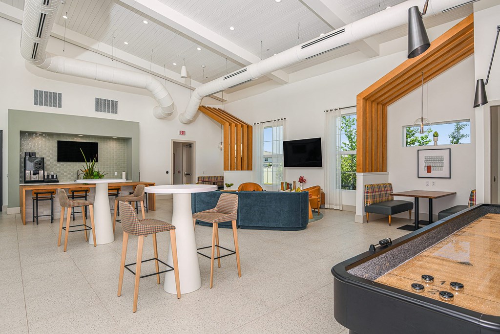 a room with a foosball table and a couch