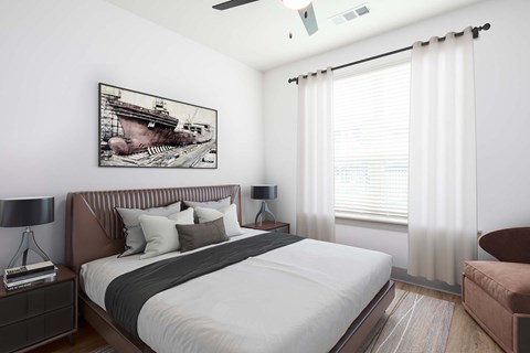 A bedroom with a large bed and a painting on the wall.