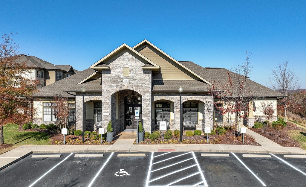 a house with a parking lot in front of it
