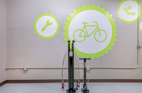 the wall is decorated with images of bicycles and tools