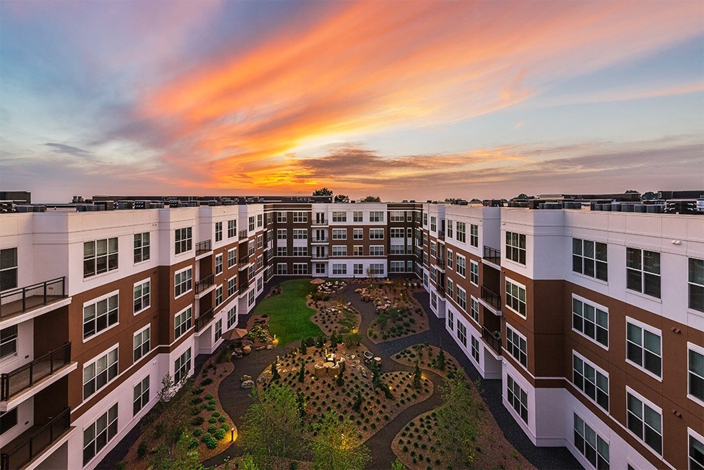 the vue beachwood aerial view of courtyard and building with sunset