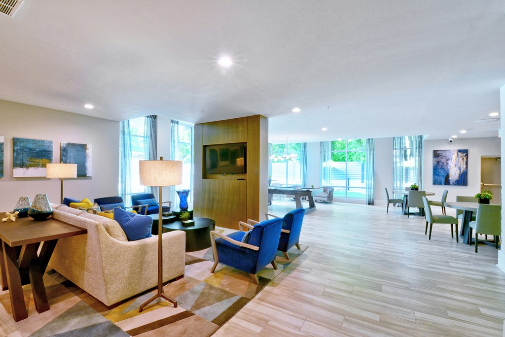 a living room with a couch and chairs and a table