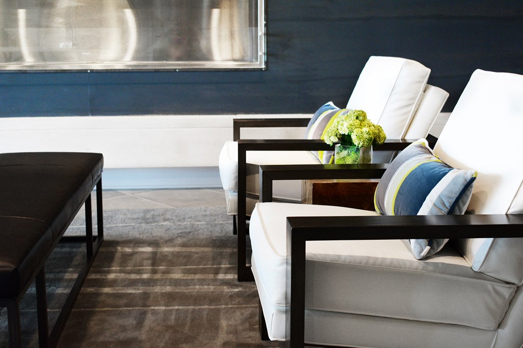 a living room with a white couch and a table