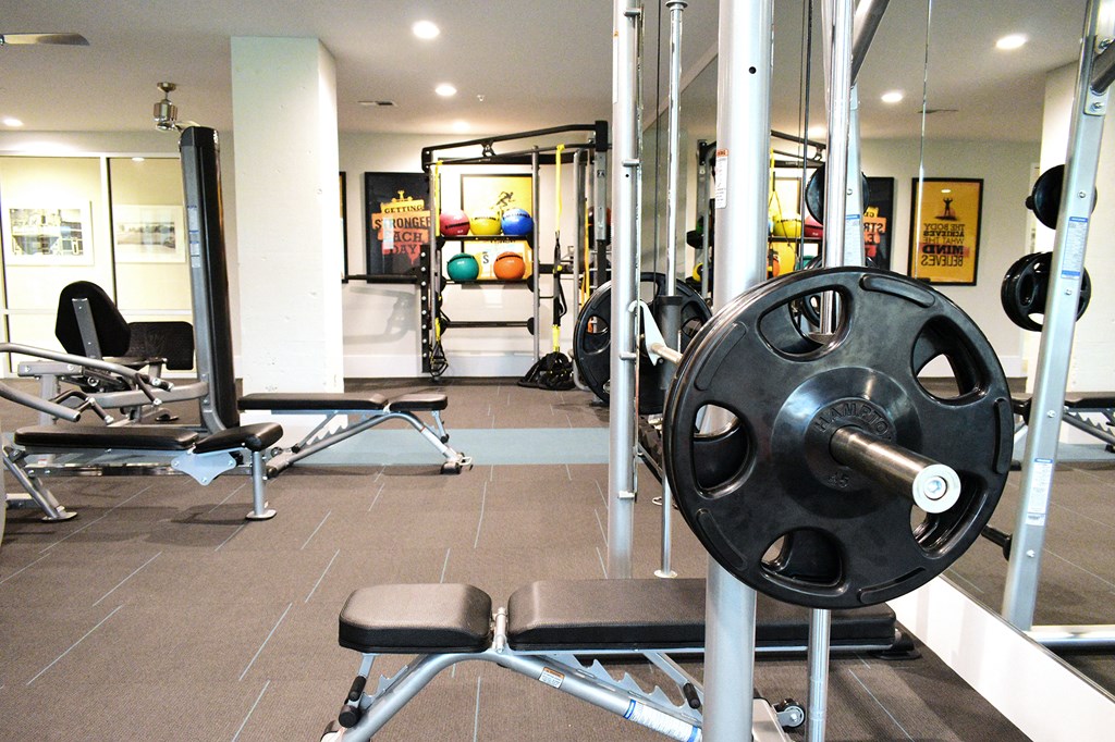 a gym with weights and other workout equipment