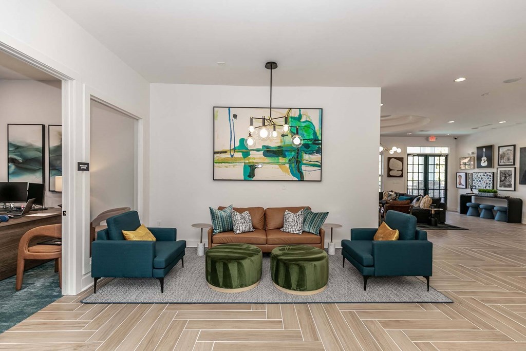 a living room with a couch and chairs