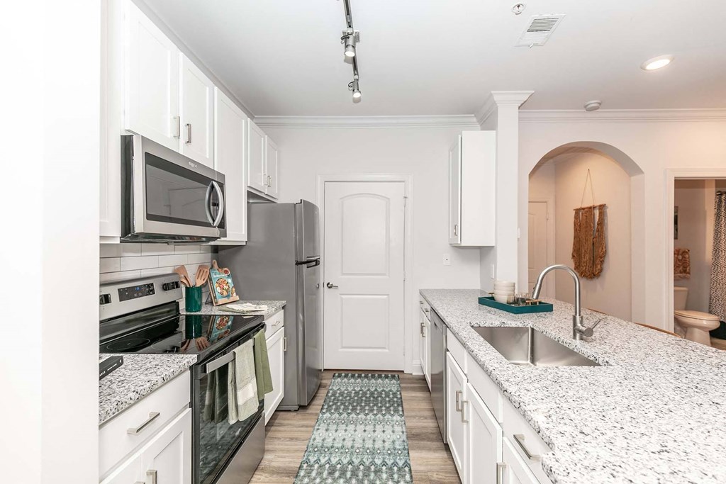 a kitchen with a counter top and a sink