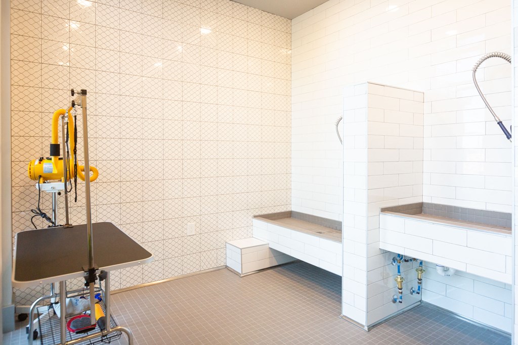 a bathroom with a shower and a sink and a bath tub