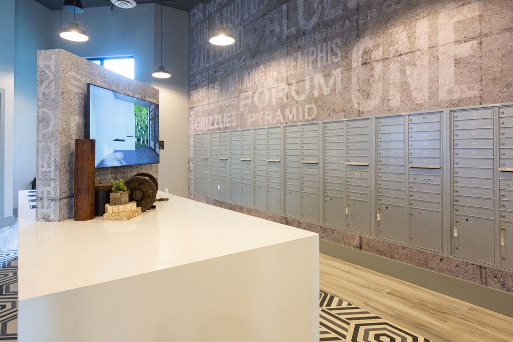 a locker room with lockers and a table with a tv