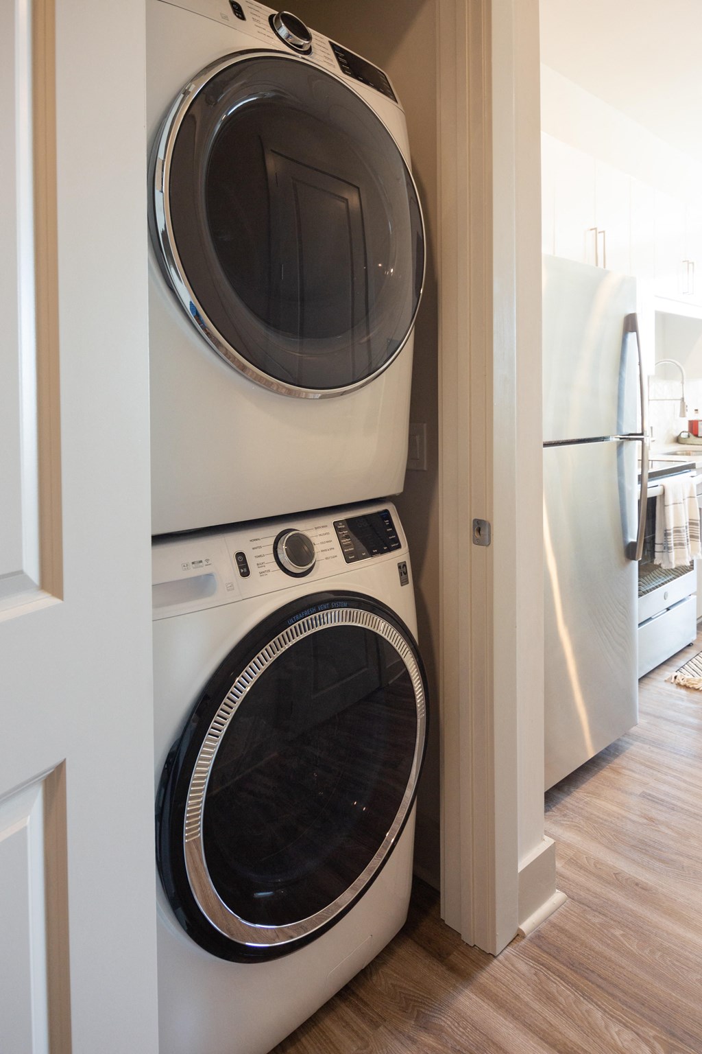 a front loading washer and dryer in a small closet