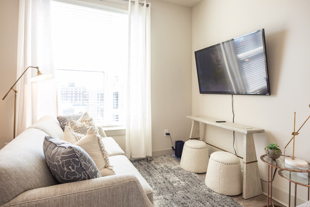 a living room with a couch and a tv