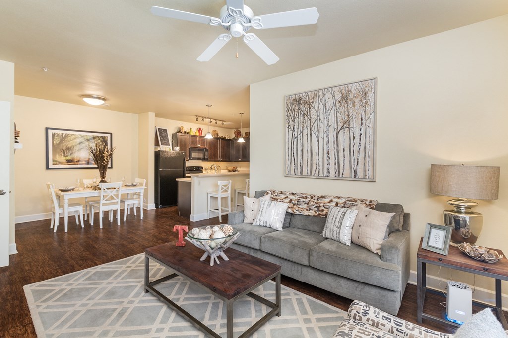 a living room and dining room with a couch and a coffee table