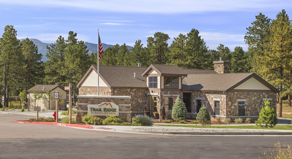 a house with a flag on a pole in front of a street