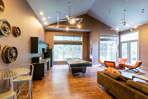 Fully Furnished Apartments for Rent in Johnson City, TN - University Edge - Activity And Club Room With Billiards Table, Lounge Seating, Vaulted Ceiling, Modern Lighting, And Large Windows.