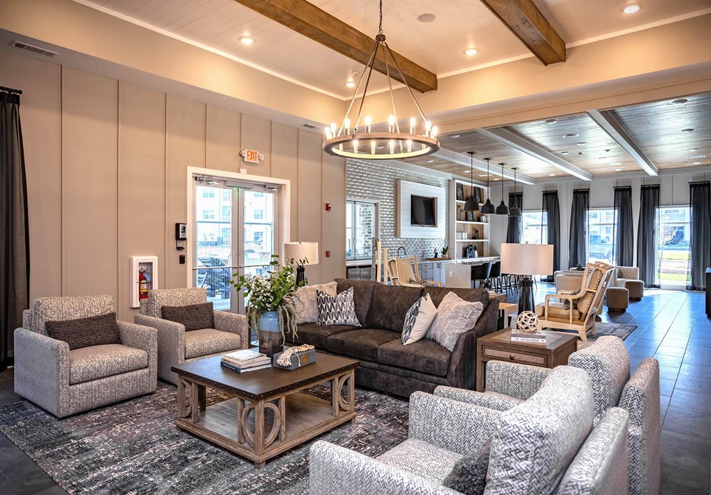 a living room filled with furniture and a large window