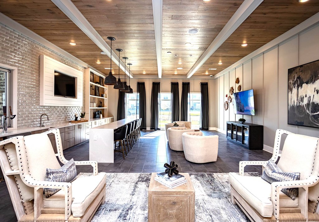 a living room filled with furniture and a flat screen tv