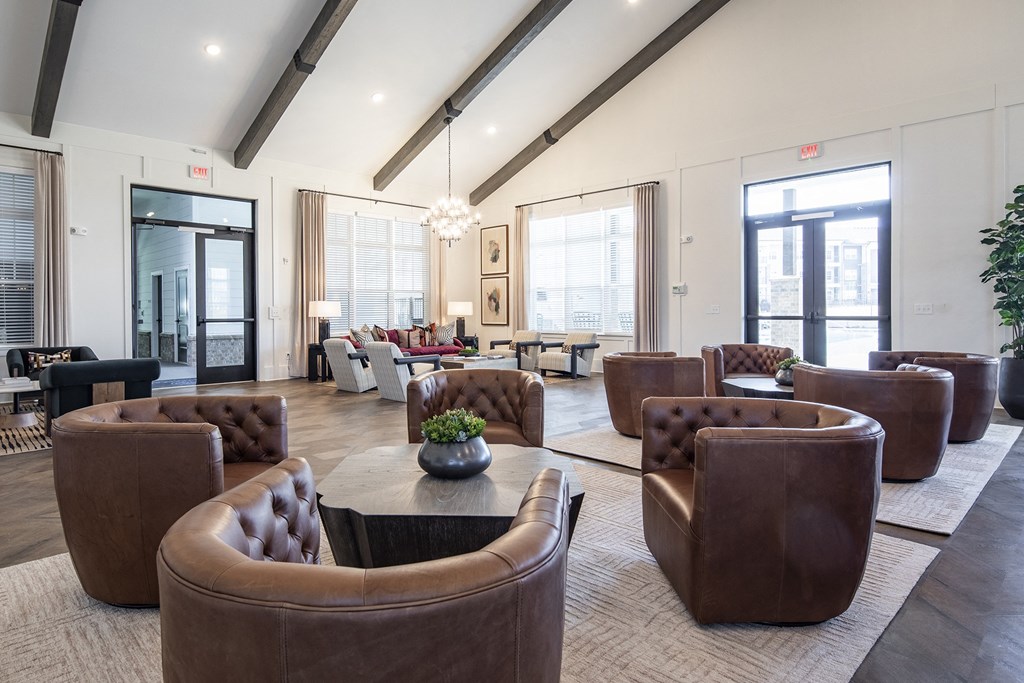 a living room with couches and chairs and a table