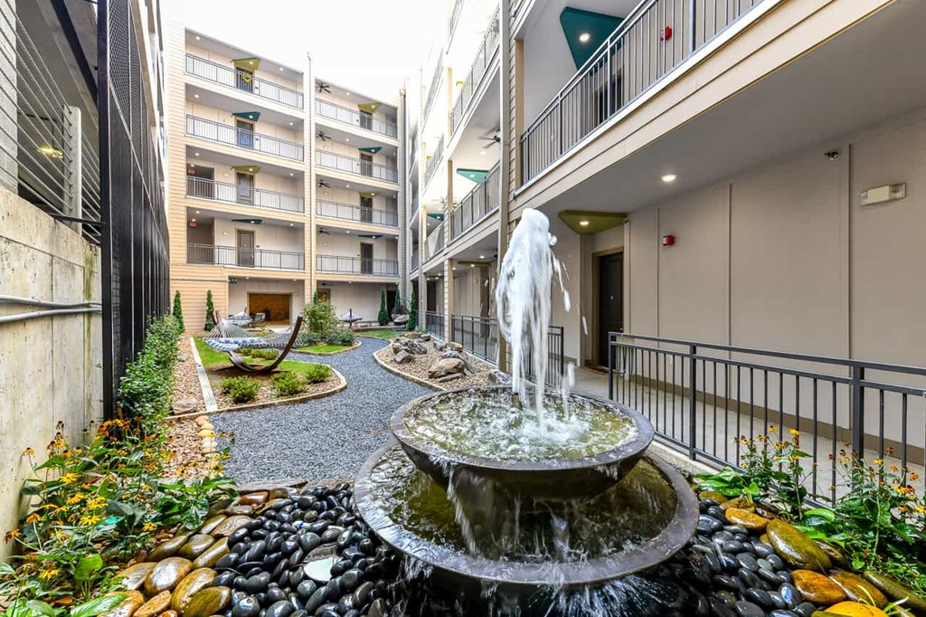 Apartments For Rent In Decatur, GA - Relax In The Community Zen Garden. Zen Garden Has A Water Fountain, A Smooth Black Stone Path, Landscaping, And Hammocks