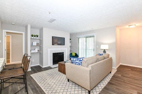 a living room with a couch and a fireplace