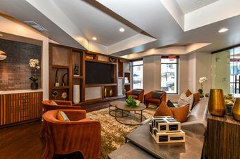 a living room filled with furniture and a large flat screen tv