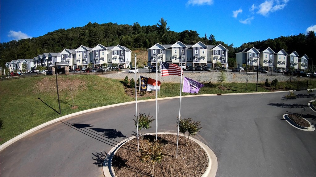 A roundabout with a flag pole in the middle of it.