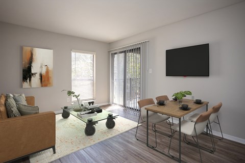 A living room with a brown couch, a glass coffee table, a dining table with chairs, and a painting on the wall.