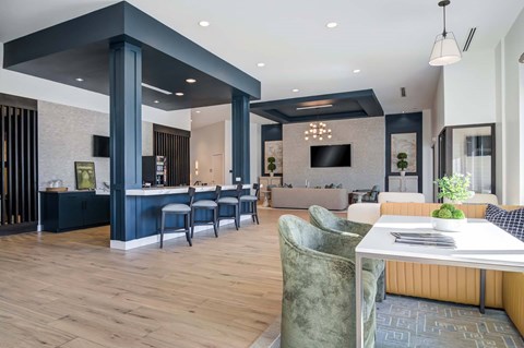 A modern dining area with a table set for two.