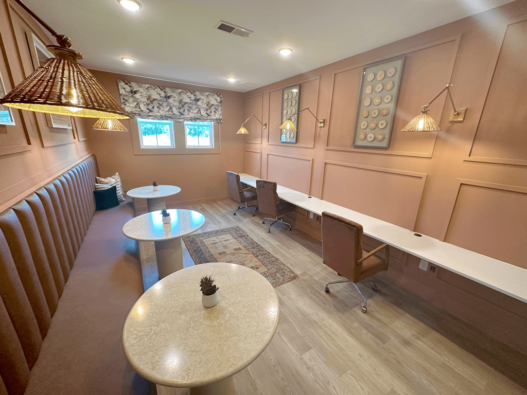 A room with brown walls and a white table in the middle.