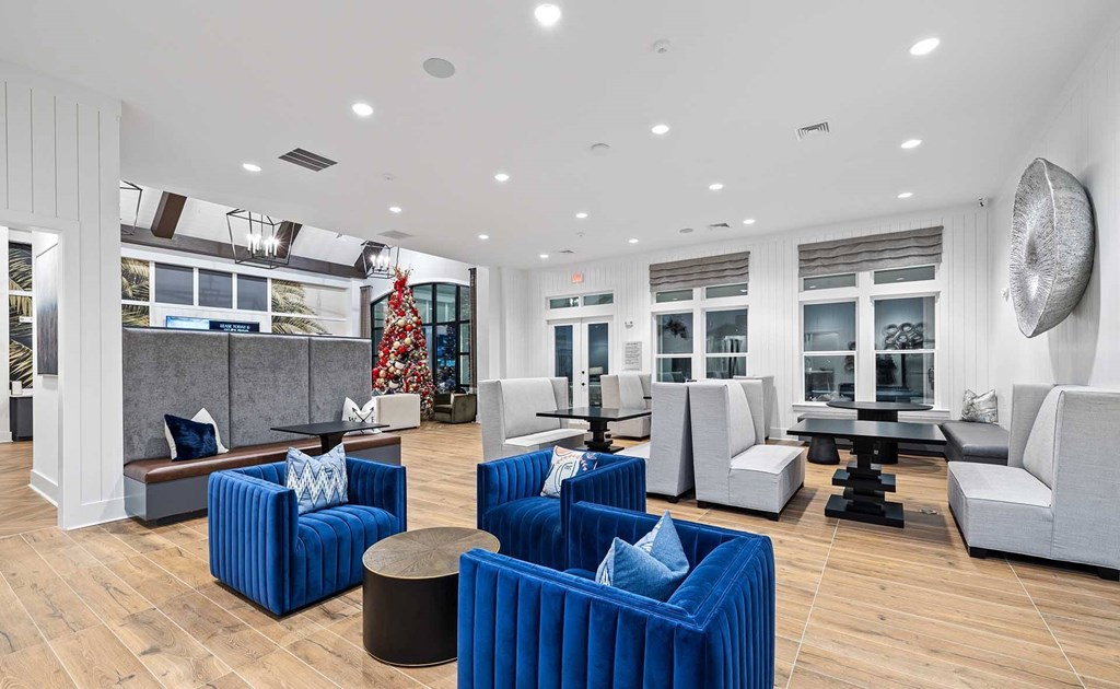 A living room with blue and white furniture.