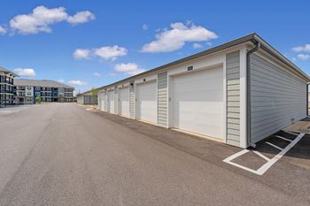 a row of garage doors on the side of a building