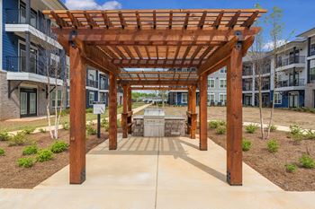 a covered patio with a fountain in the middle of an apartment building