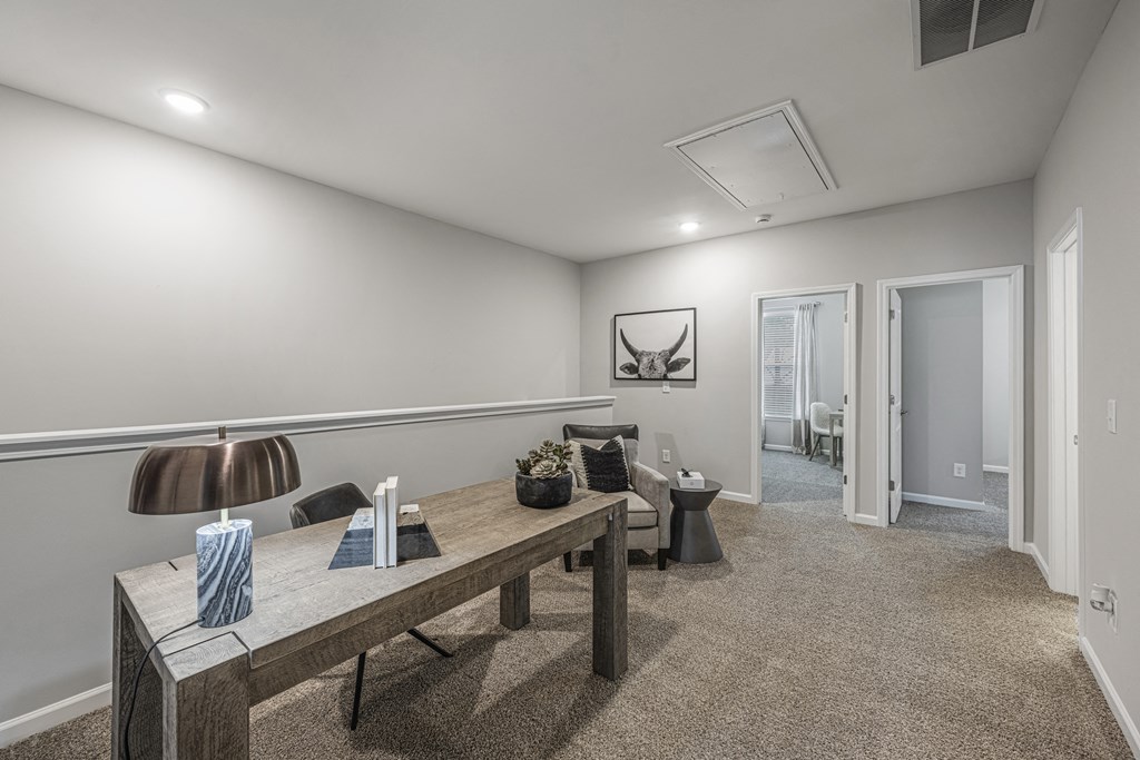 a living room with a long wooden dining table