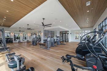 a gym with a lot of exercise equipment
